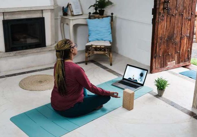 african-senior-woman-doing-online-yoga-lesson-at-h-2023-11-27-05-13-32-utc