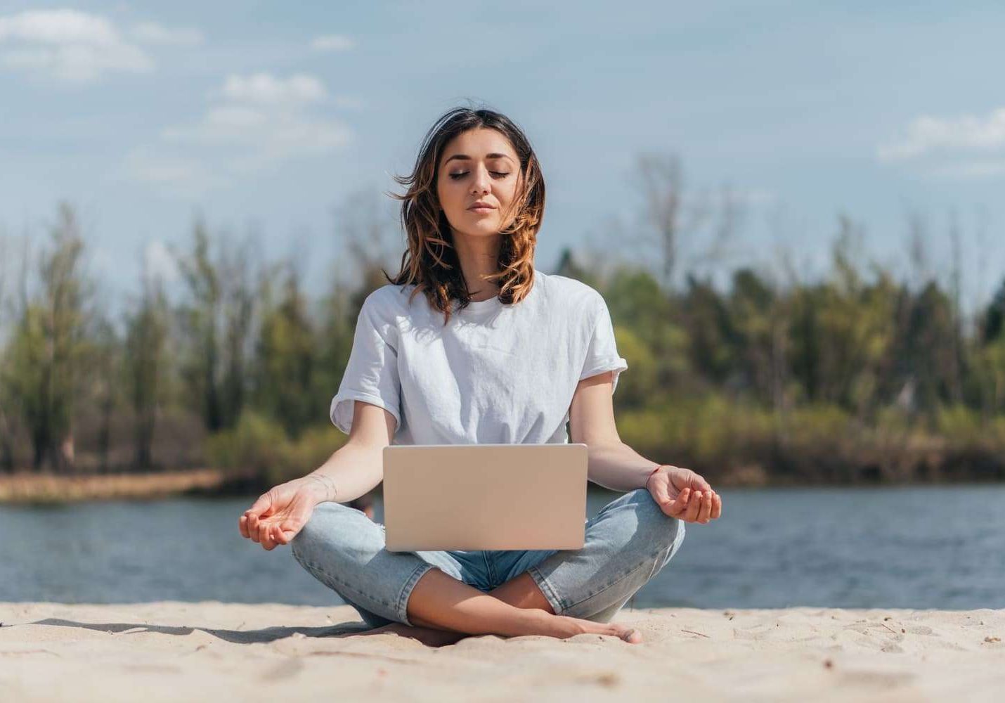 attractive-freelancer-with-closed-eyes-meditating-2024-11-18-06-28-03-utc