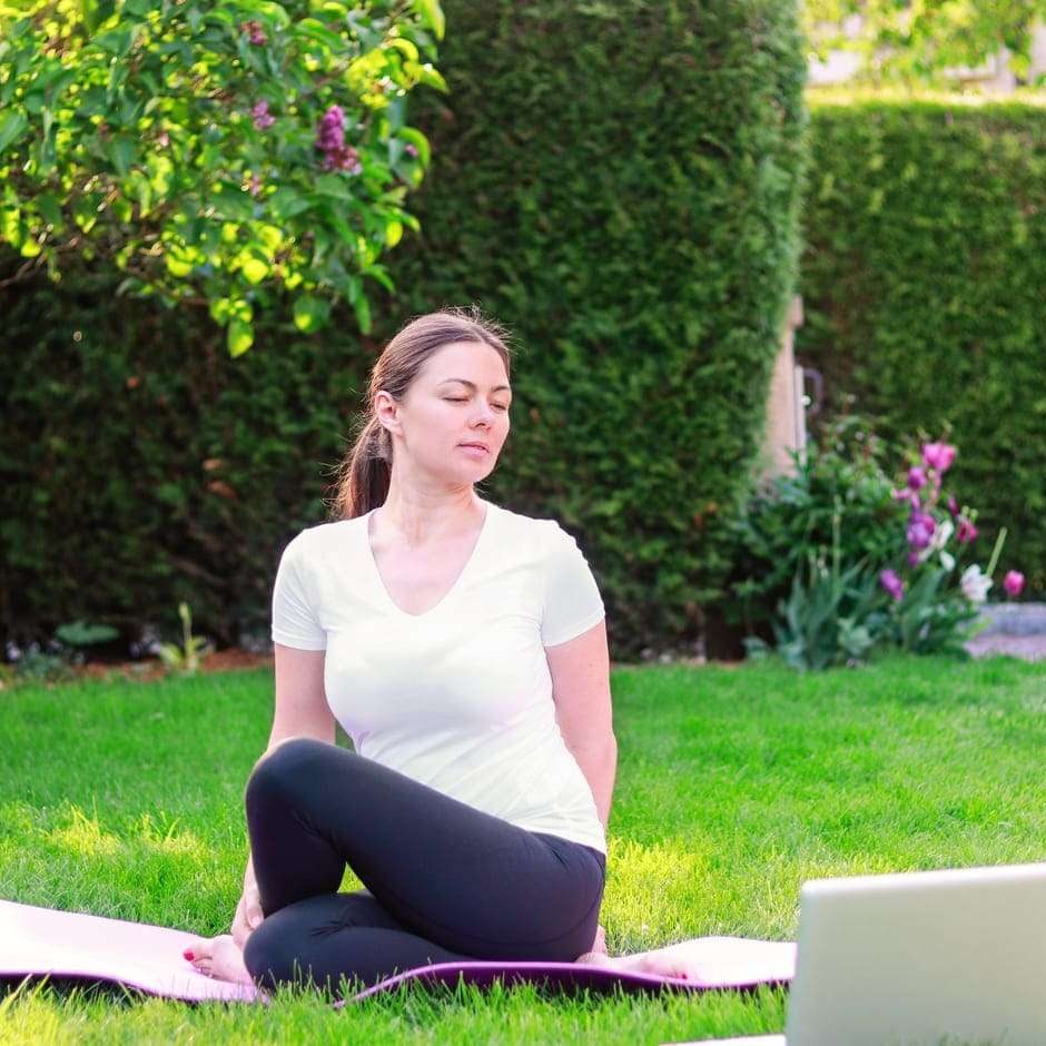 beautiful-young-woman-practicing-yoga-in-garden-ou-2023-11-27-05-05-46-utc