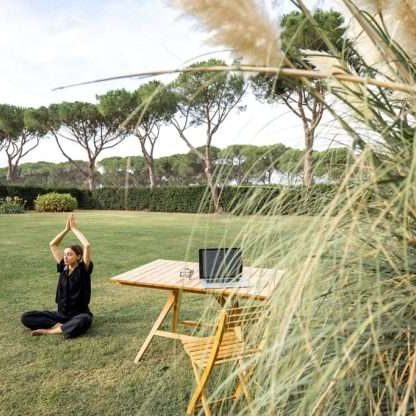 girl-meditating-and-practicing-yoga-on-green-lawn-2023-11-27-05-25-29-utc