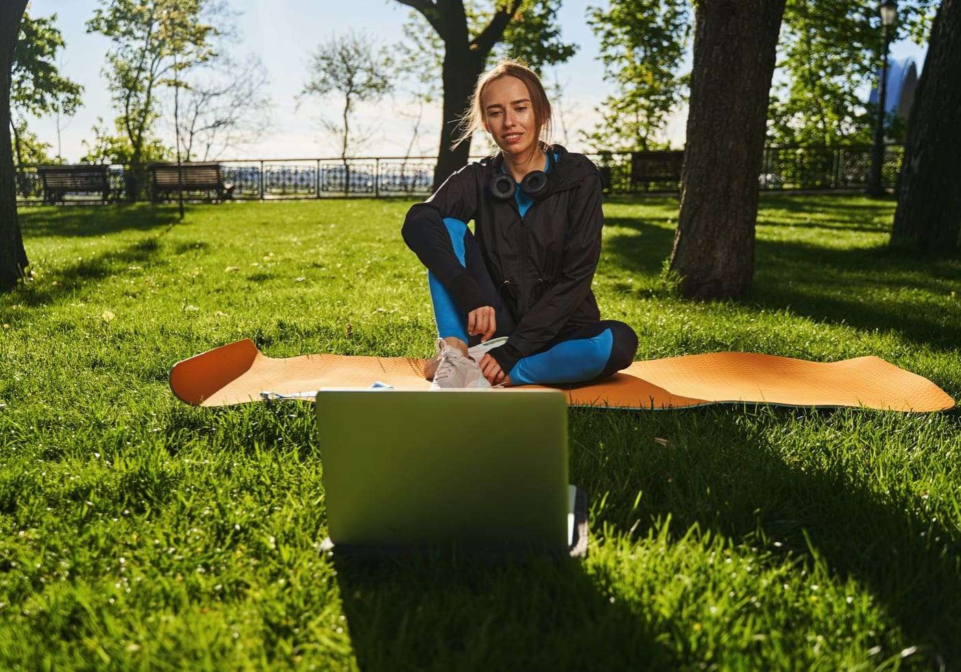 happy-young-woman-training-online-in-open-air-2024-10-18-10-11-23-utc